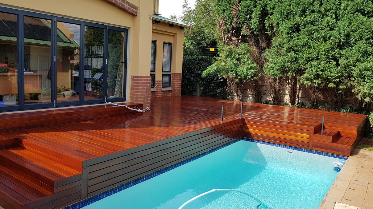A red ironbark pool deck constructed by Timbermann adds luxury to an outdoor space.